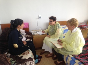 The author with Prof. Tadevosyan as she takes an obstetric history from a postpartum patient, June 2015.